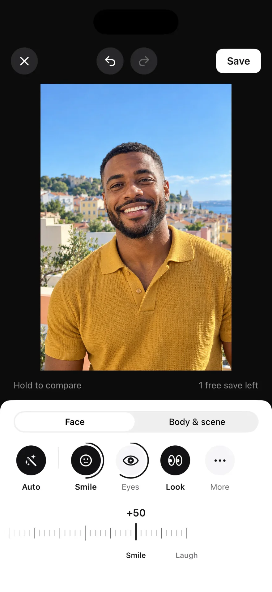 The Glowly editor on iPhone with Auto applied: the man on the rooftop now has his eyes open and smiles at the camera
